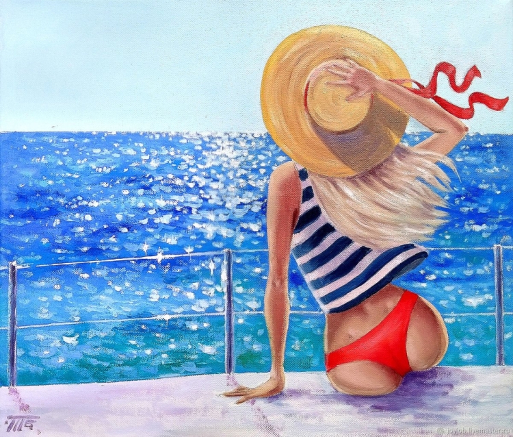 Девушка в шляпе у моря